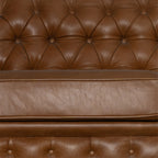 Brown leather sofa with tufted backrest