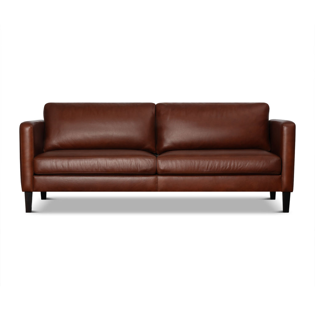 Brown leather sofa on a white background